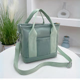 Wasserabweisende Canvas-Handtasche mit geflochtenem Riemen
