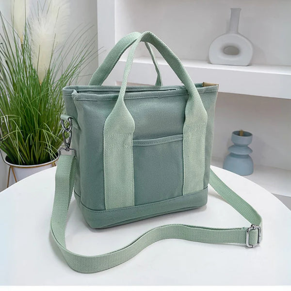 Wasserabweisende Canvas-Handtasche mit geflochtenem Riemen