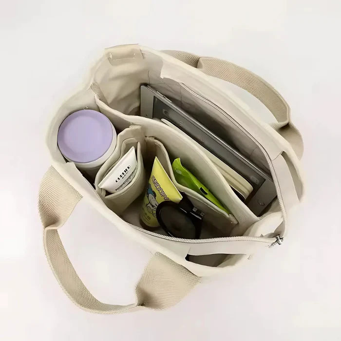 Wasserabweisende Canvas-Handtasche mit geflochtenem Riemen