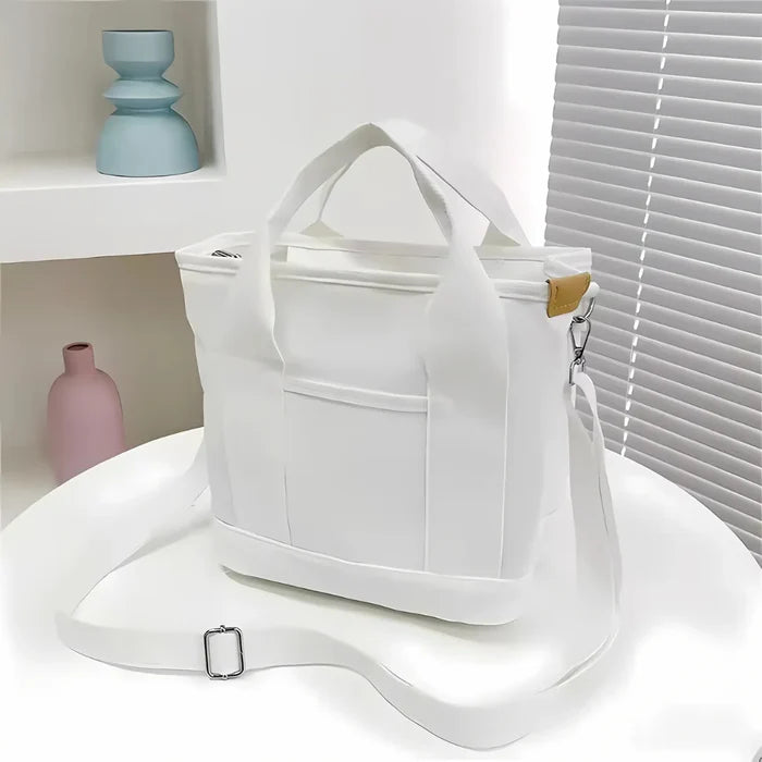 Wasserabweisende Canvas-Handtasche mit geflochtenem Riemen